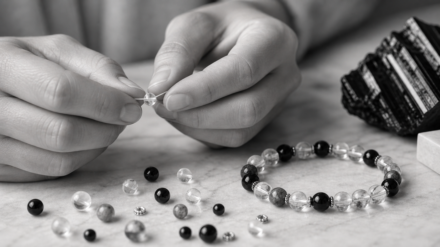 Hands making a crystal bracelet